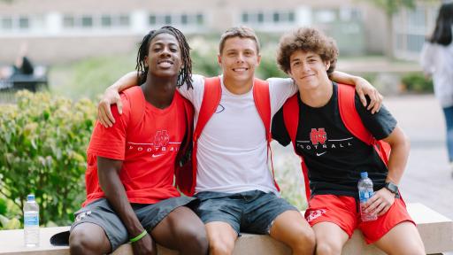 Students posing for a photo outside