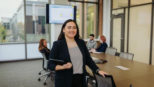 Student standing in conference room