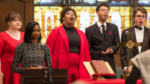 Students singing in chapel