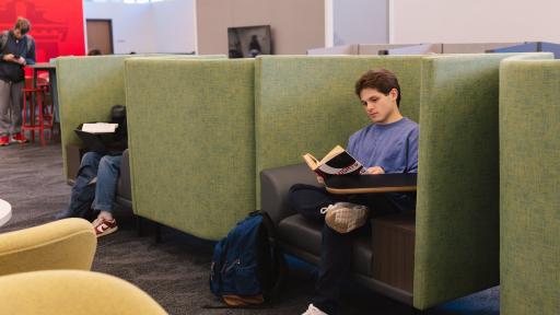 student reading in the library