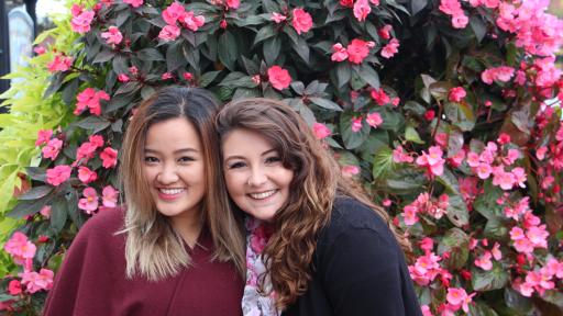 Students smiling on the Naperville Riverwalk