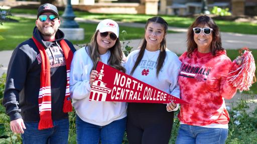 Family holding NCC pennant